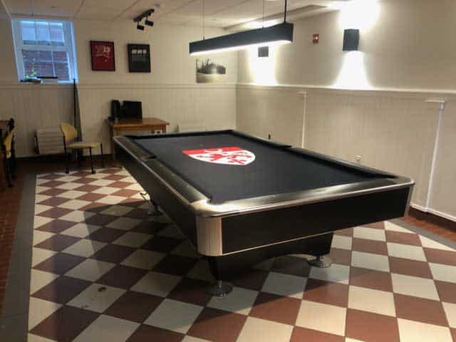 yale pool table with a crest