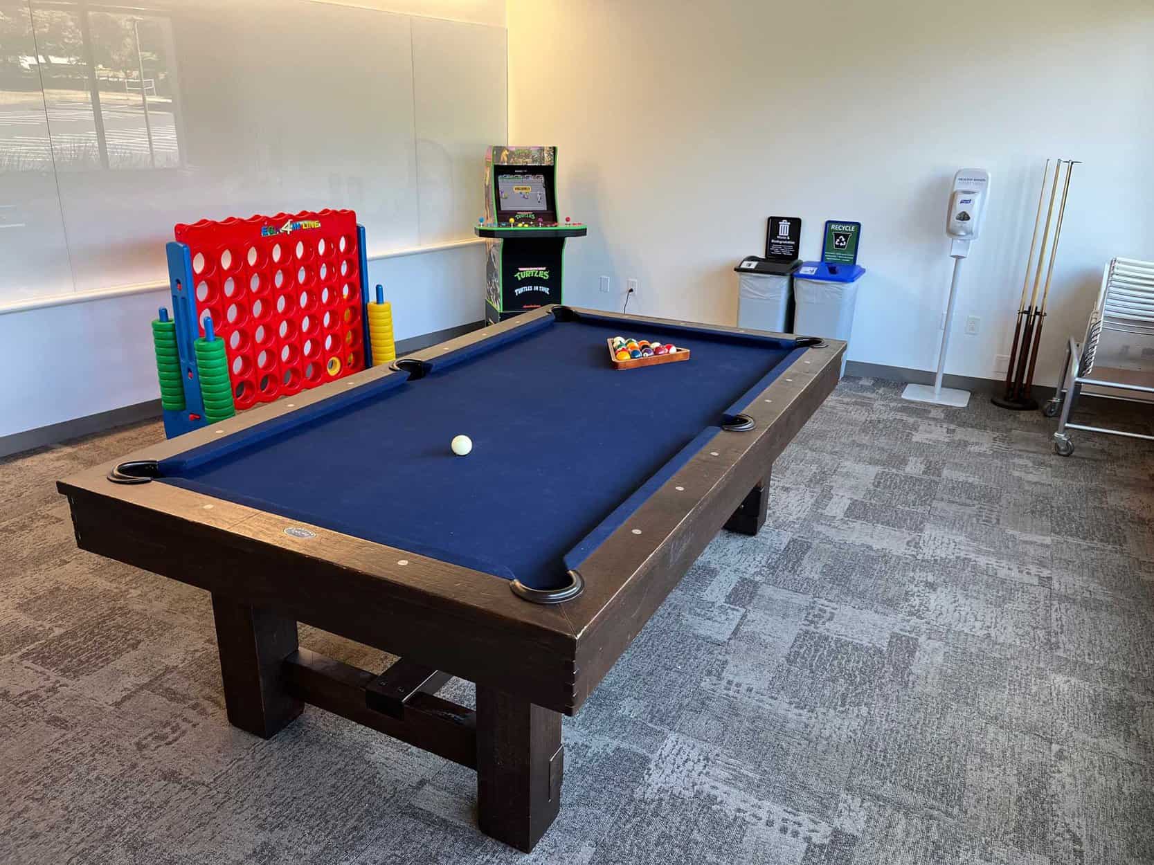 blue pool table with arcade and giant connect 4