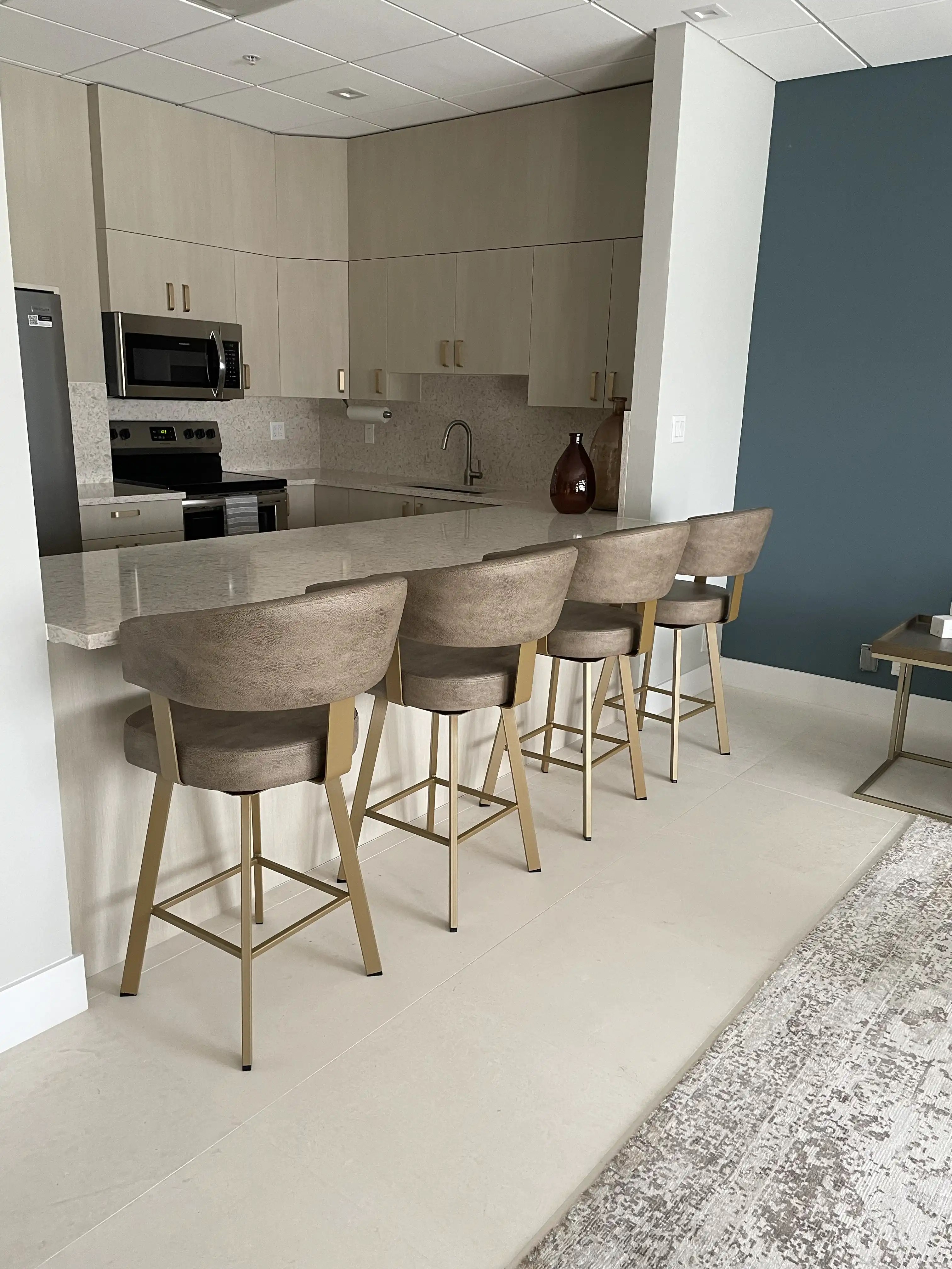 stools in a beige and turquoise kitchen