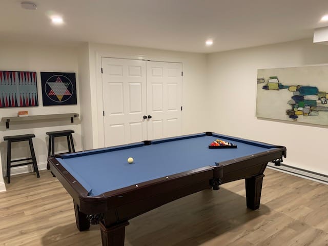 blue pool table in a white room