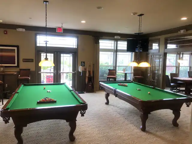 two green felt pool tables