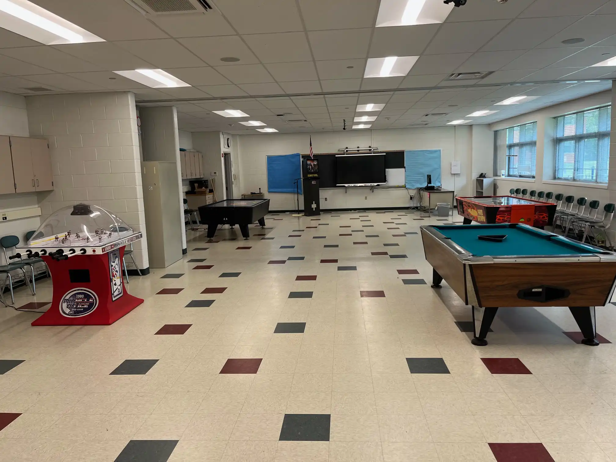 Town of Westport, CT game room with a pool table, bubble hockey and air hockey