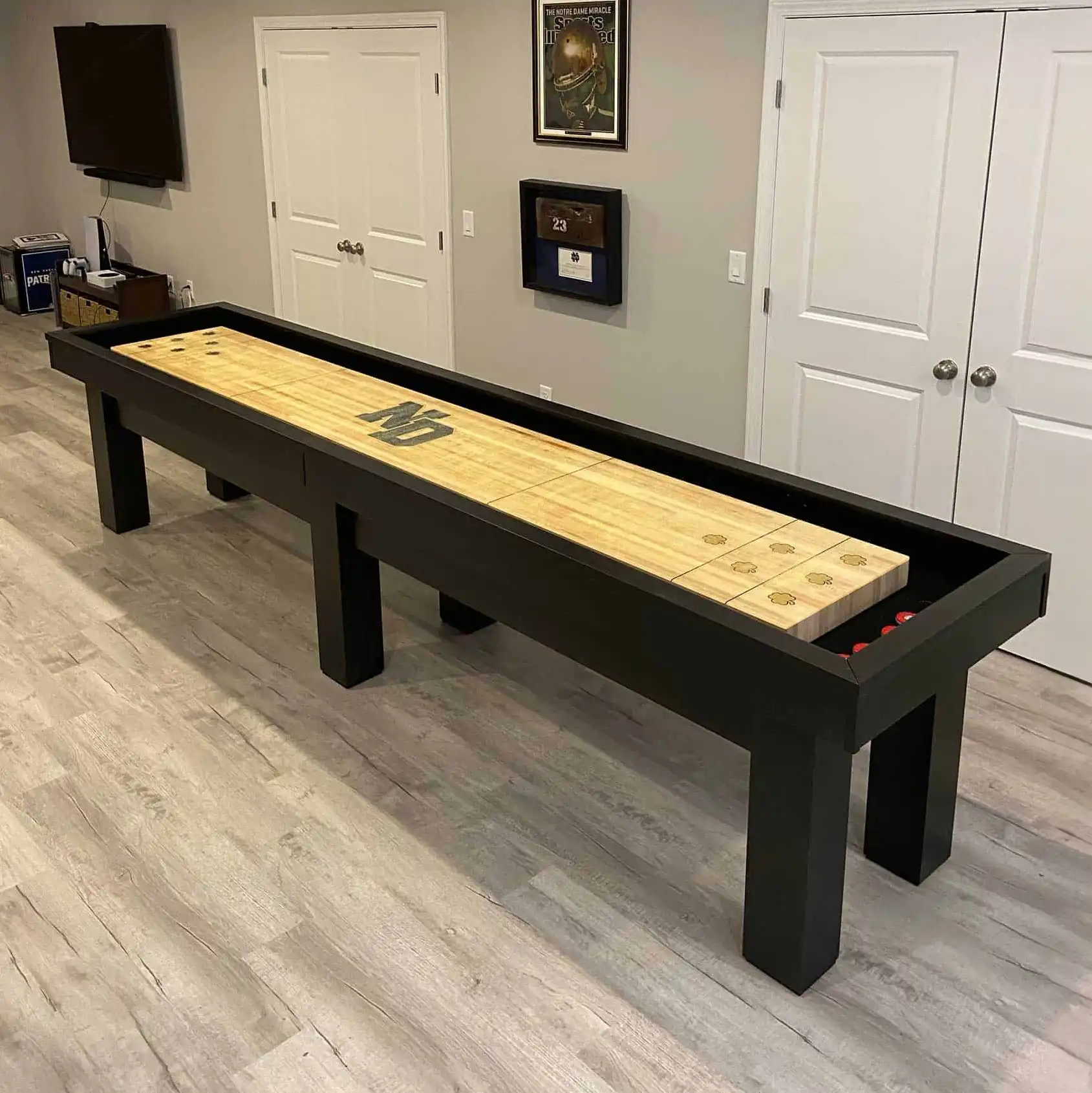 Shuffleboard table with a Notre Dame logo