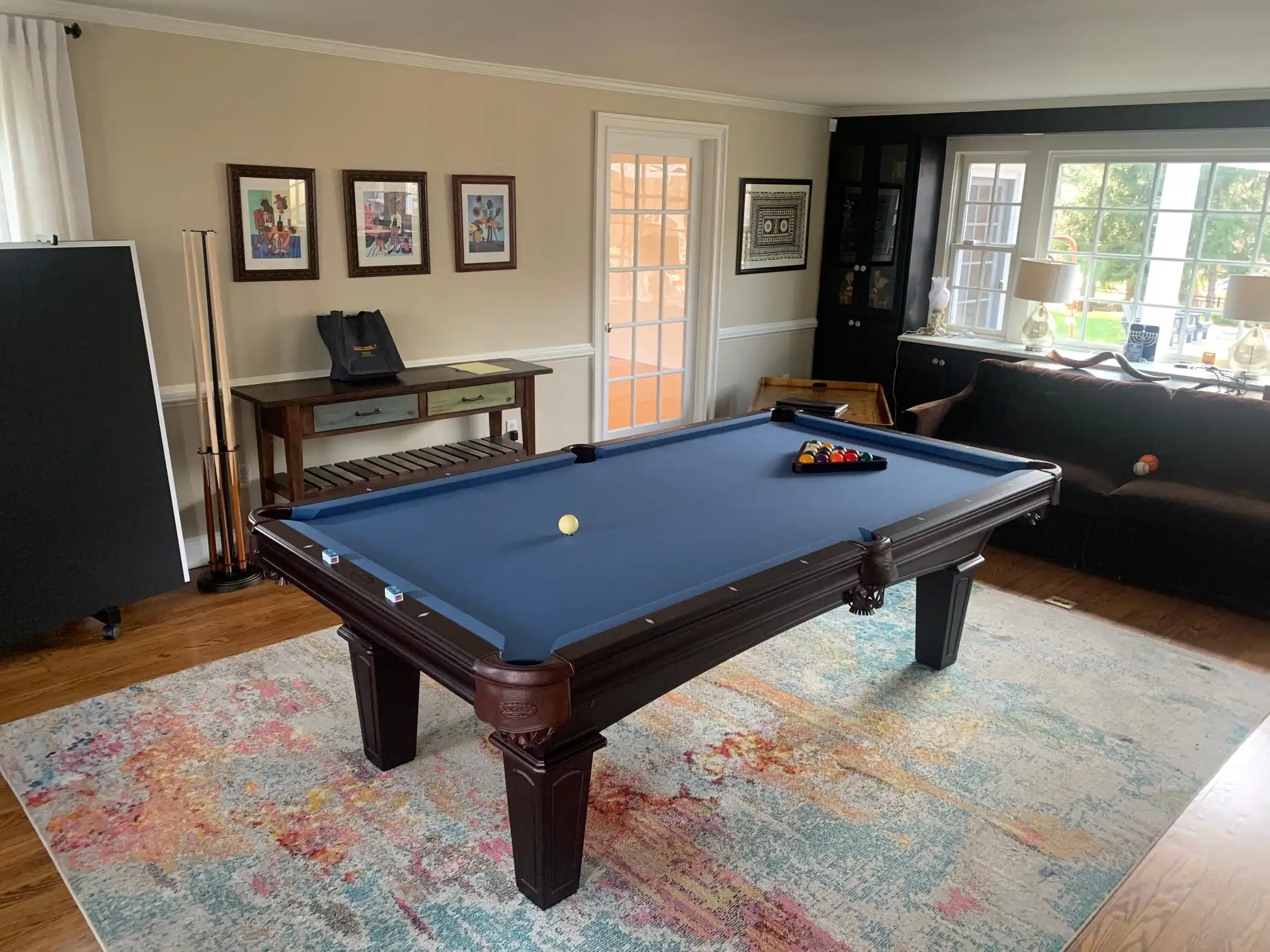 Blue Olhausen table on a multi colored rug