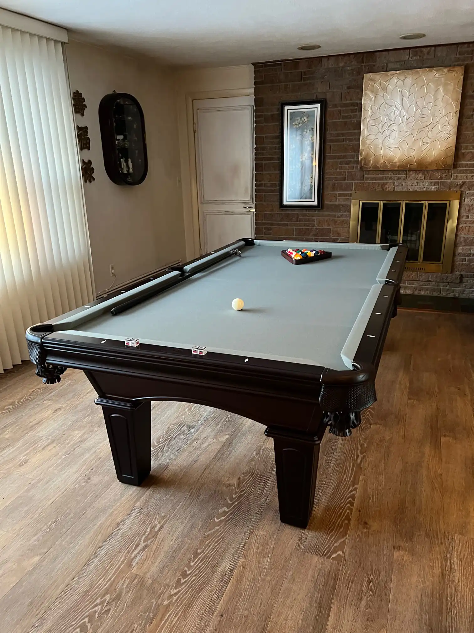 light green pool table, hardwood floor