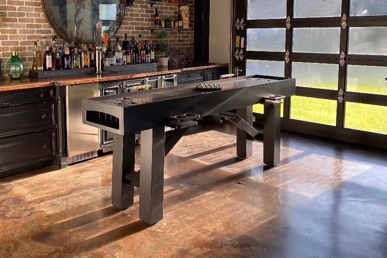 black skeech table in a kitchen bar with a big garage door