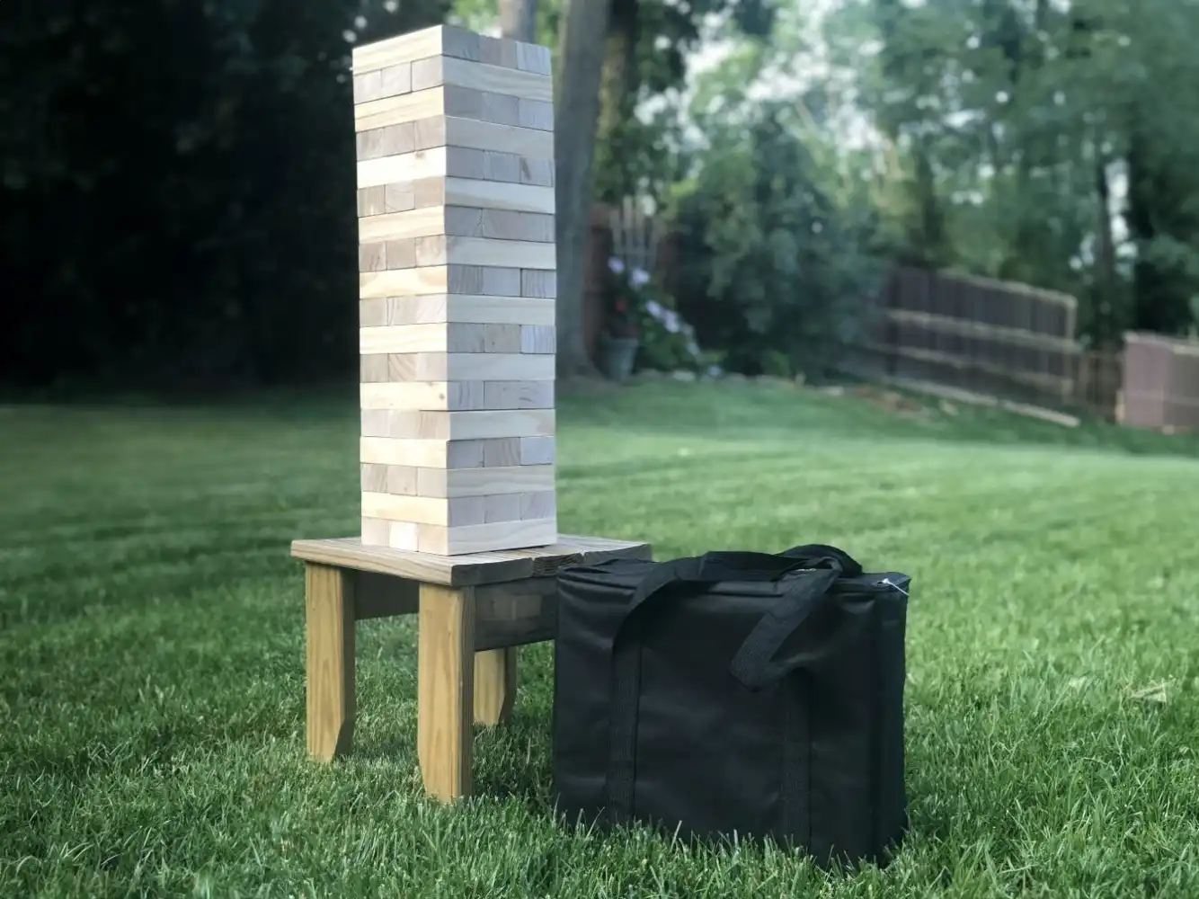 giant jenga tumbling tower wood blocks outside with carrying case