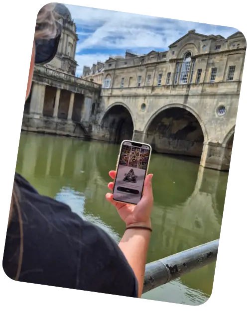 A player exploring Bath during The Lost Lady, looking towards the historic Pulteney Bridge.