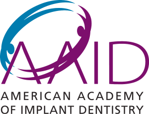 Logo of the American Academy of Implant Dentistry with blue and purple design elements.