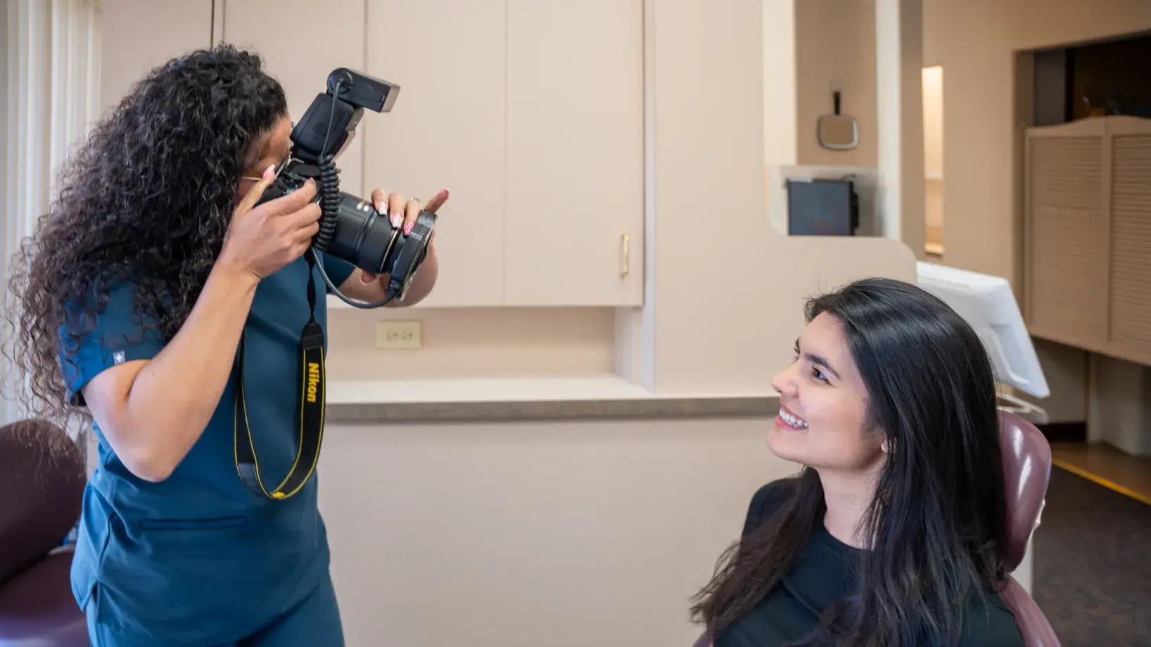 Team member taking a patient's picture