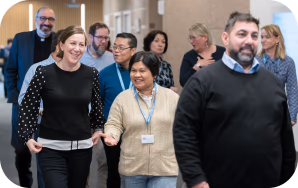 Church leaders and staff walking together at a church gathering