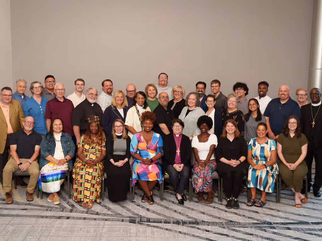 Group photo of members of the ELCA Church Council standing and seated together.