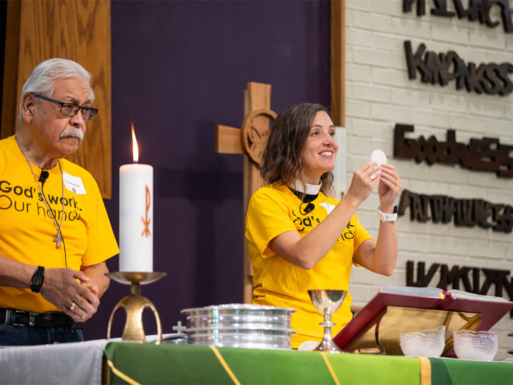 Church leaders at communion during worship