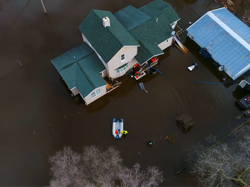 Aerial view of homes surrounded by floodwater