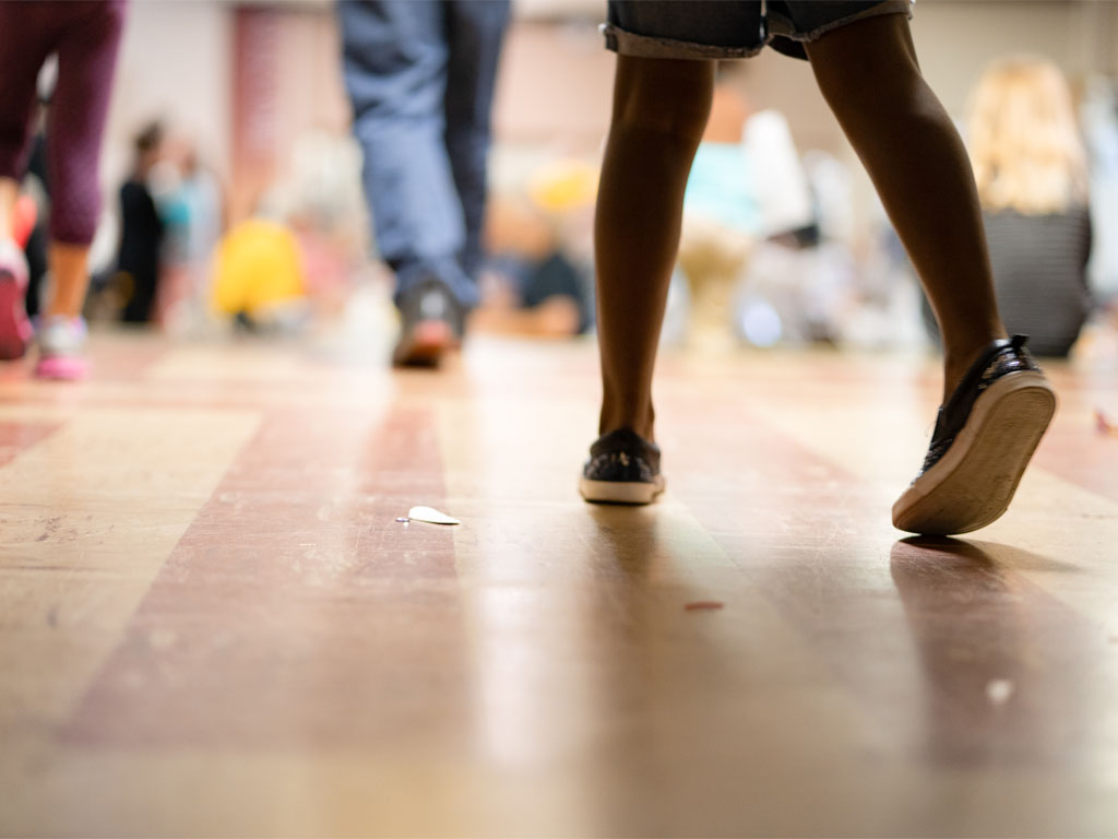 People walking indoors viewed from ground level