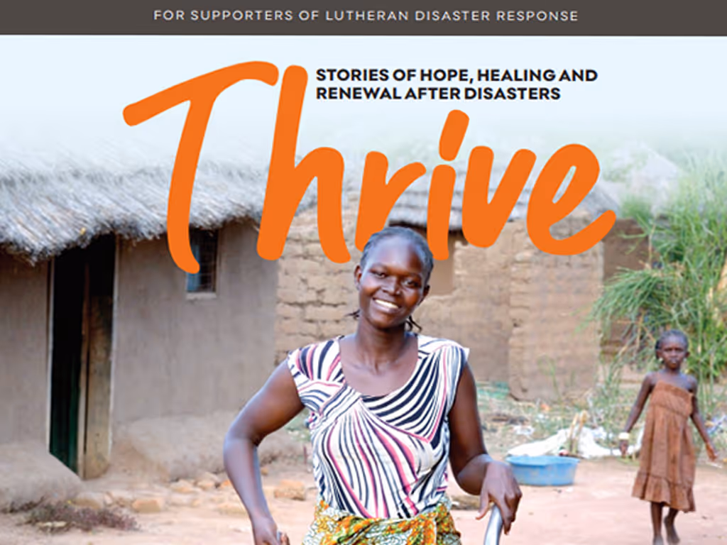 Magazine cover featuring a woman pushing a wheelbarrow with the word “Thrive” in orange letters over top.