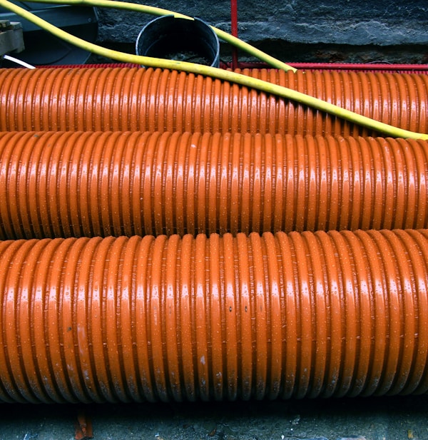 a close up of a bunch of orange hoses