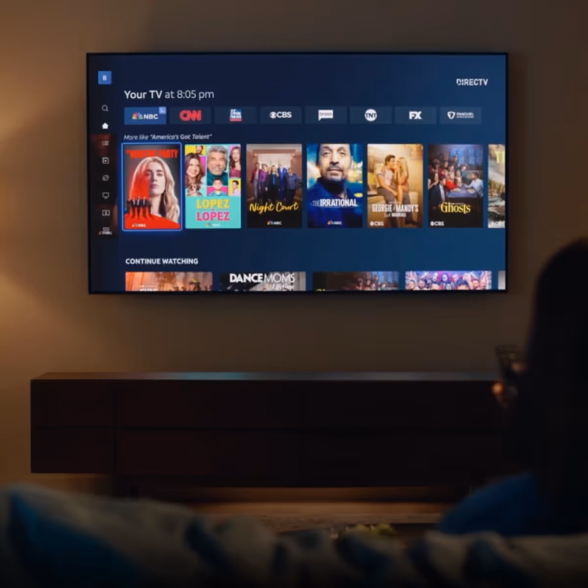 Image of television mounted on wall showing DIRECTV Stream user interface from Hilltop Broadband