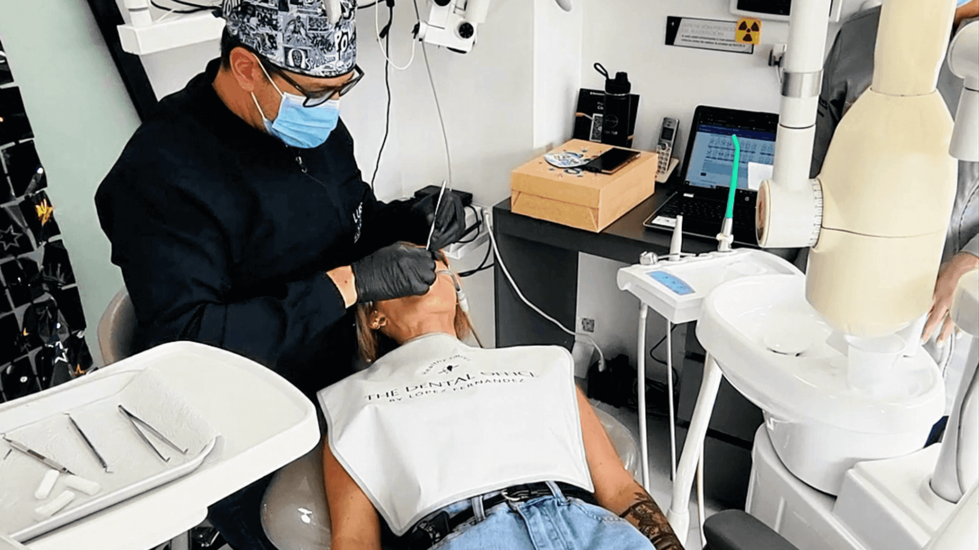 Colombian dentist performing a procedure in a modern dental clinic in Medellín as part of a dental tourism experience.