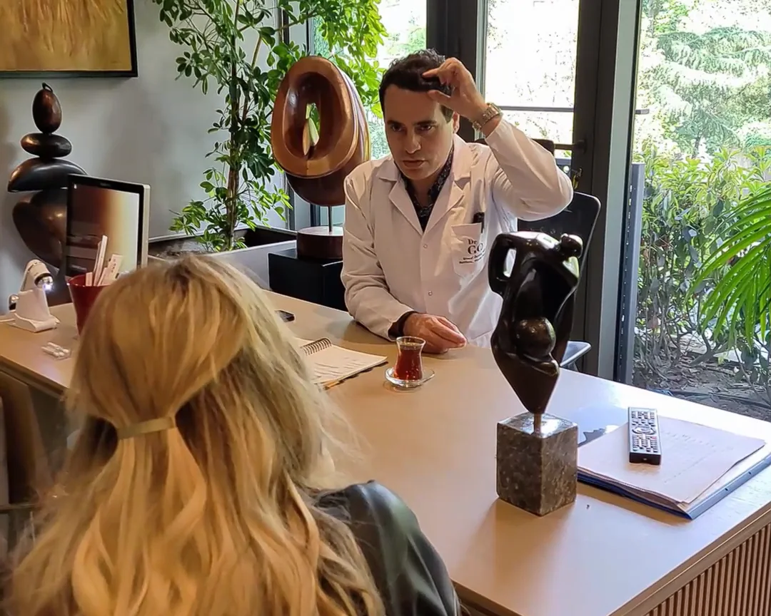 air transplant consultation with doctor showing scalp concerns in a modern office with natural light