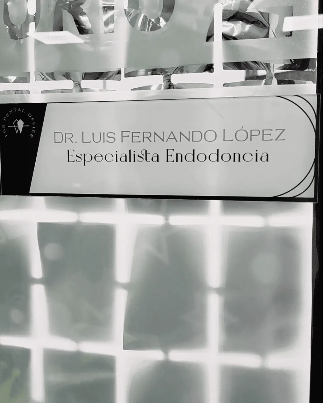 A nameplate at The Dental Office in Medellín, Colombia, showing Dr. Luis Fernando López, Endodontics Specialist.