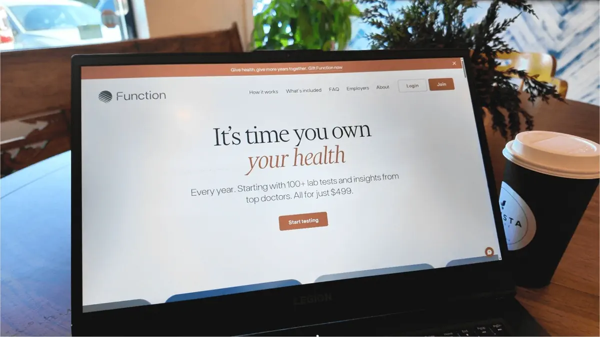 Laptop screen showing Function Health website promoting affordable $499 annual full-body health scans and lab tests in the USA with over 100 doctor-reviewed results.