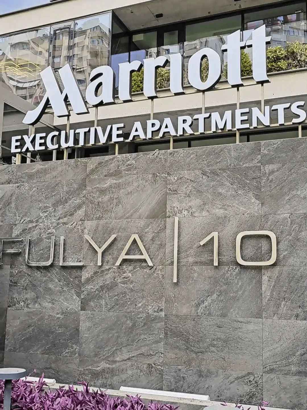 Exterior sign of Marriott Executive Apartments at Fulya 10 in Istanbul, Türkiye, often used for medical tourism stays including hair transplant trips.