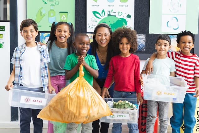 A group of students in front of milk cartons