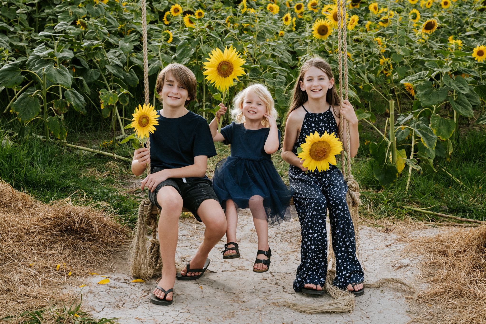 A family photographed outdoors in Northland by Photography by Nimmy