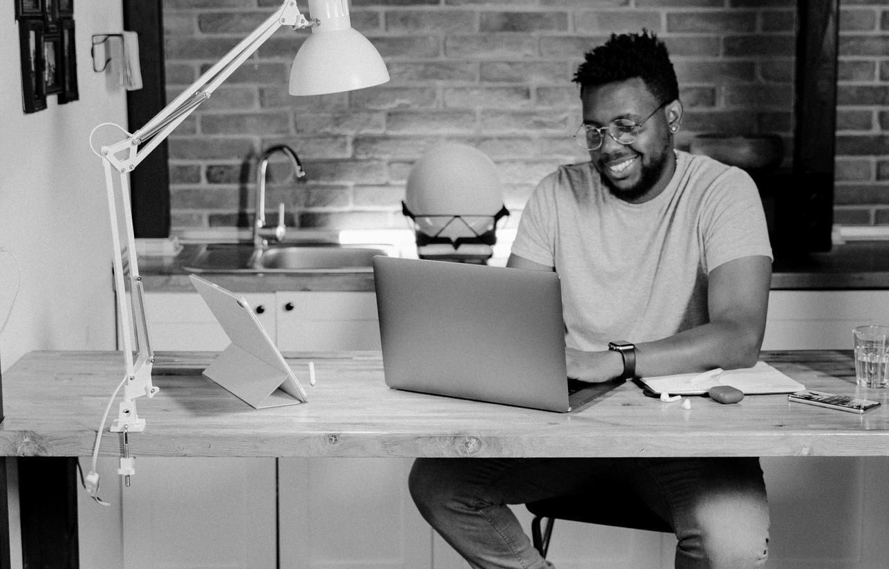 man working at laptop on table