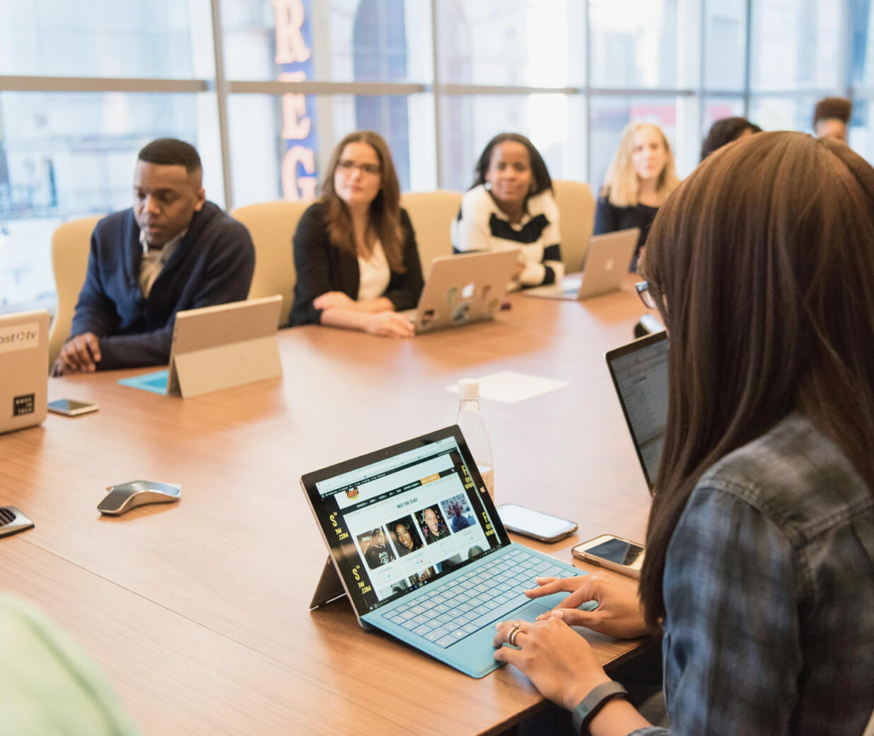 Generic team meeting in 2025, featured on Mackard about us page