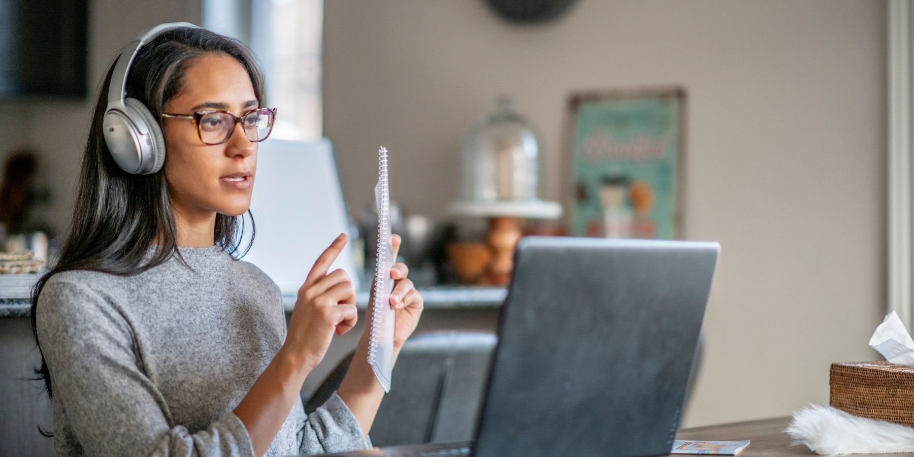 Woman with headphones using AI marketing tools on laptop in 2025, targeting responsive customers