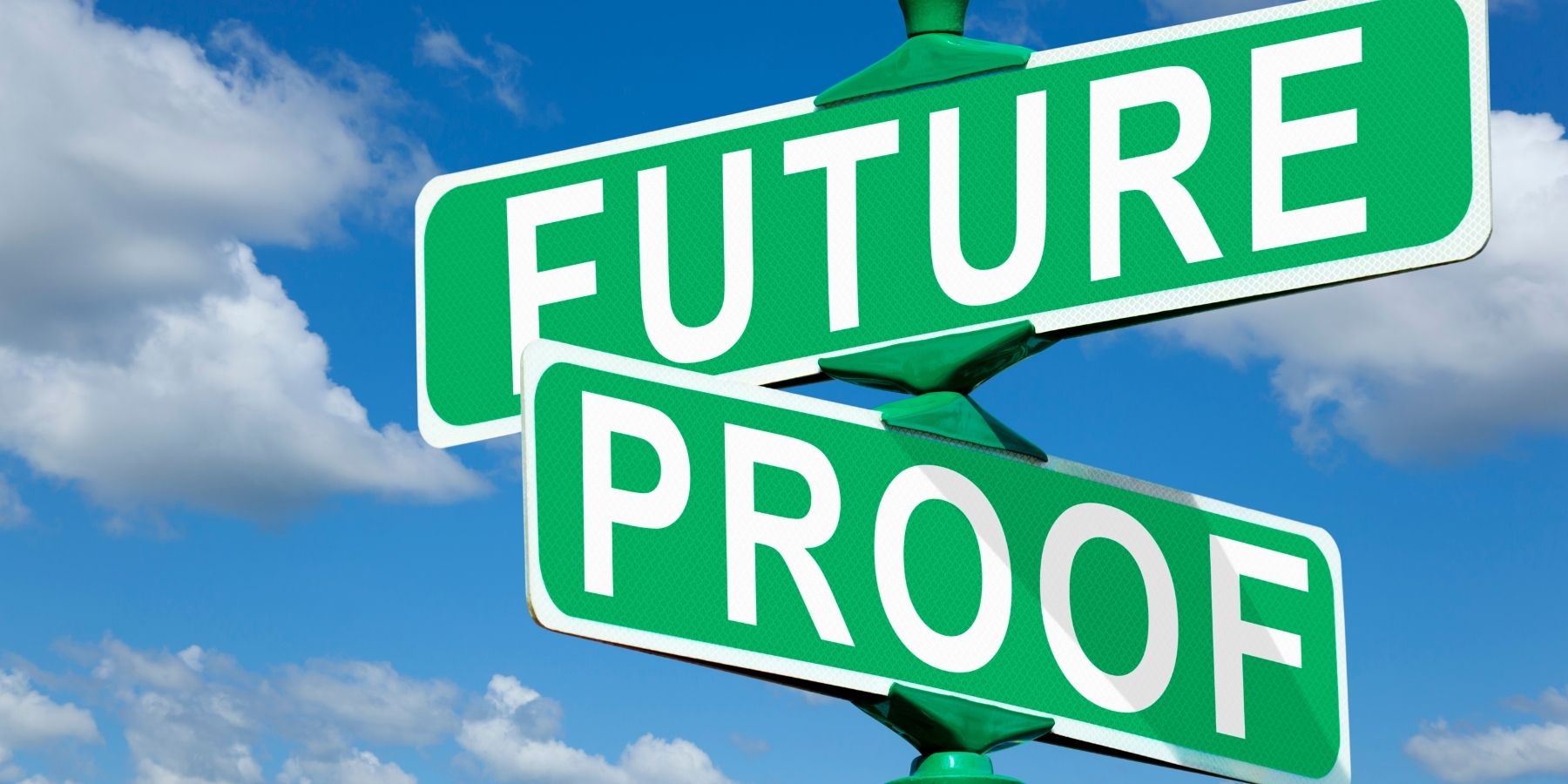 Road signs for ‘Future’ and ‘Proof’ against a blue sky, symbolizing a secure freelance career with essential skills.