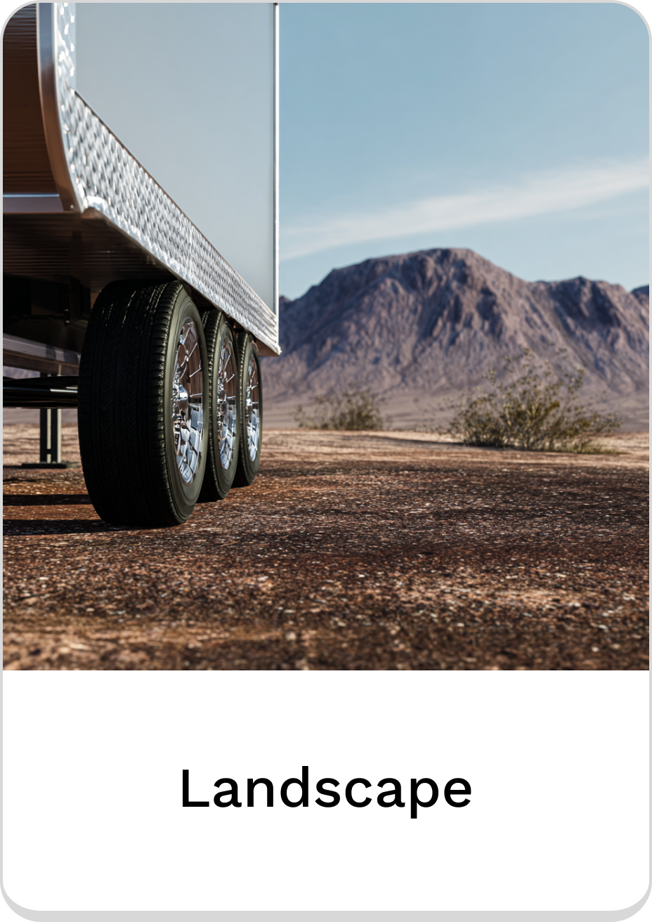 Close-up of trailer wheels in a serene landscape setting.