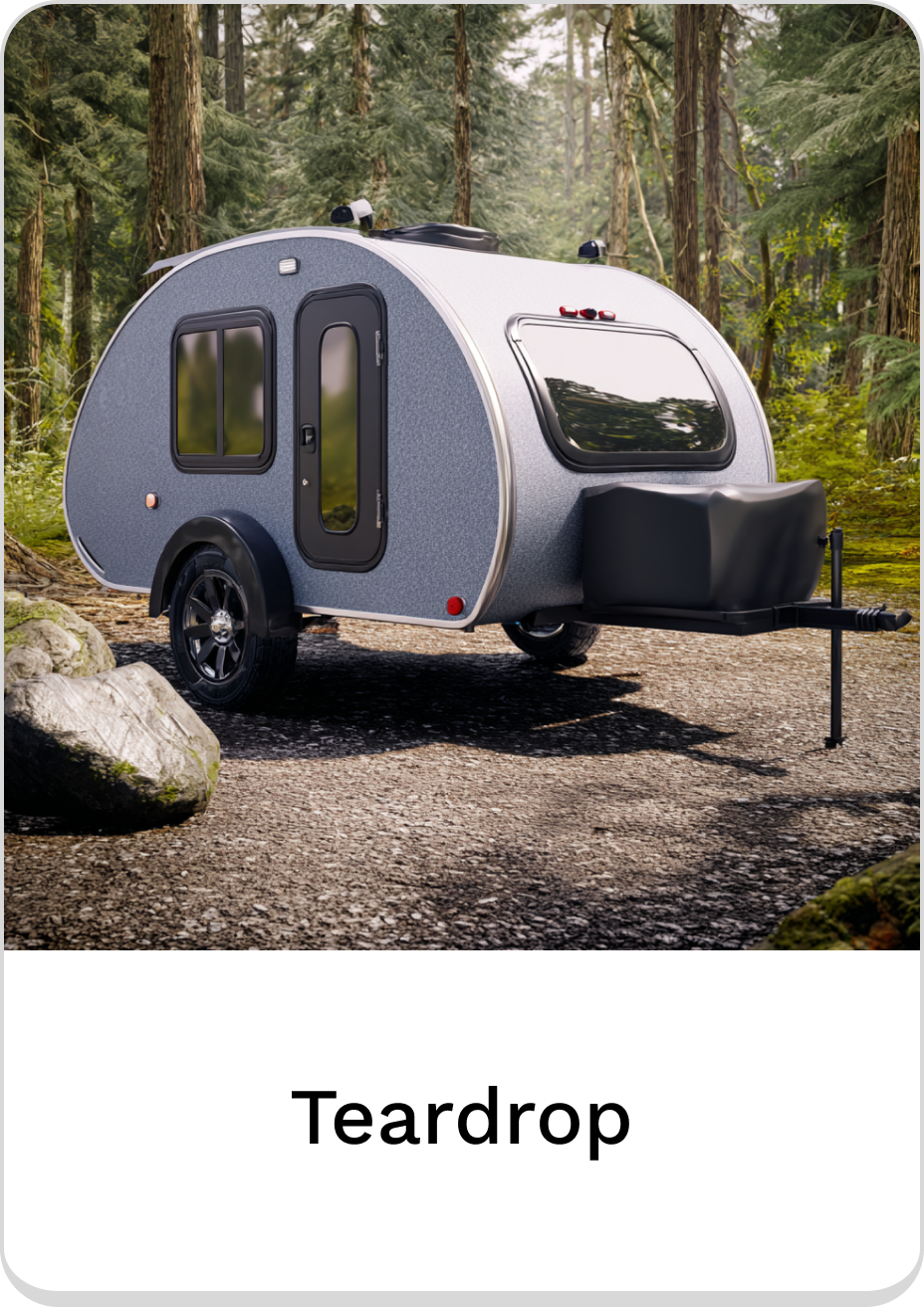 Compact teardrop camper nestled in a forest, perfect for adventurous getaways.