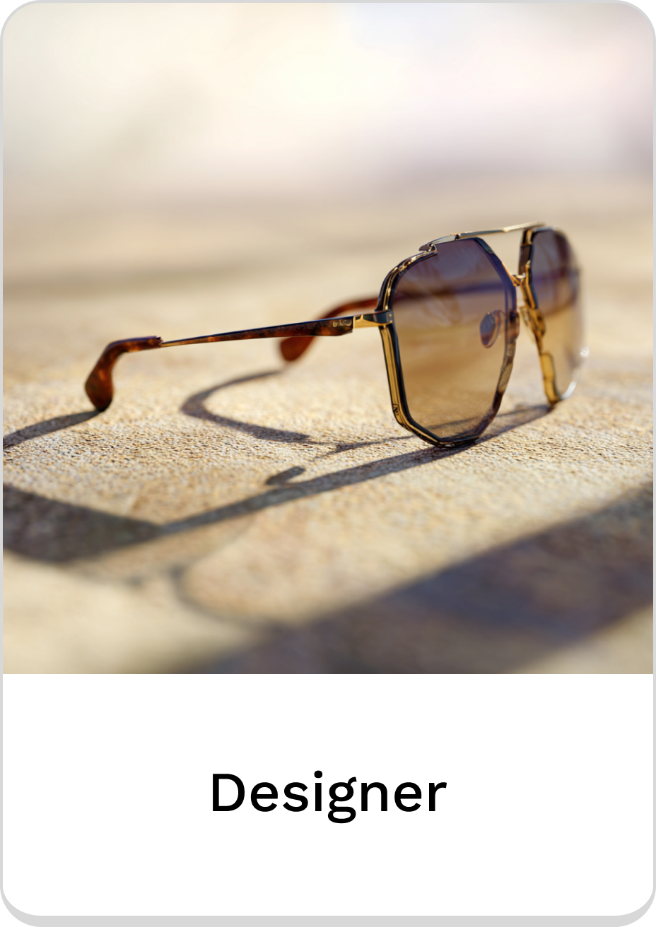 Stylish designer sunglasses resting on a sandy surface, perfect for summer outings.