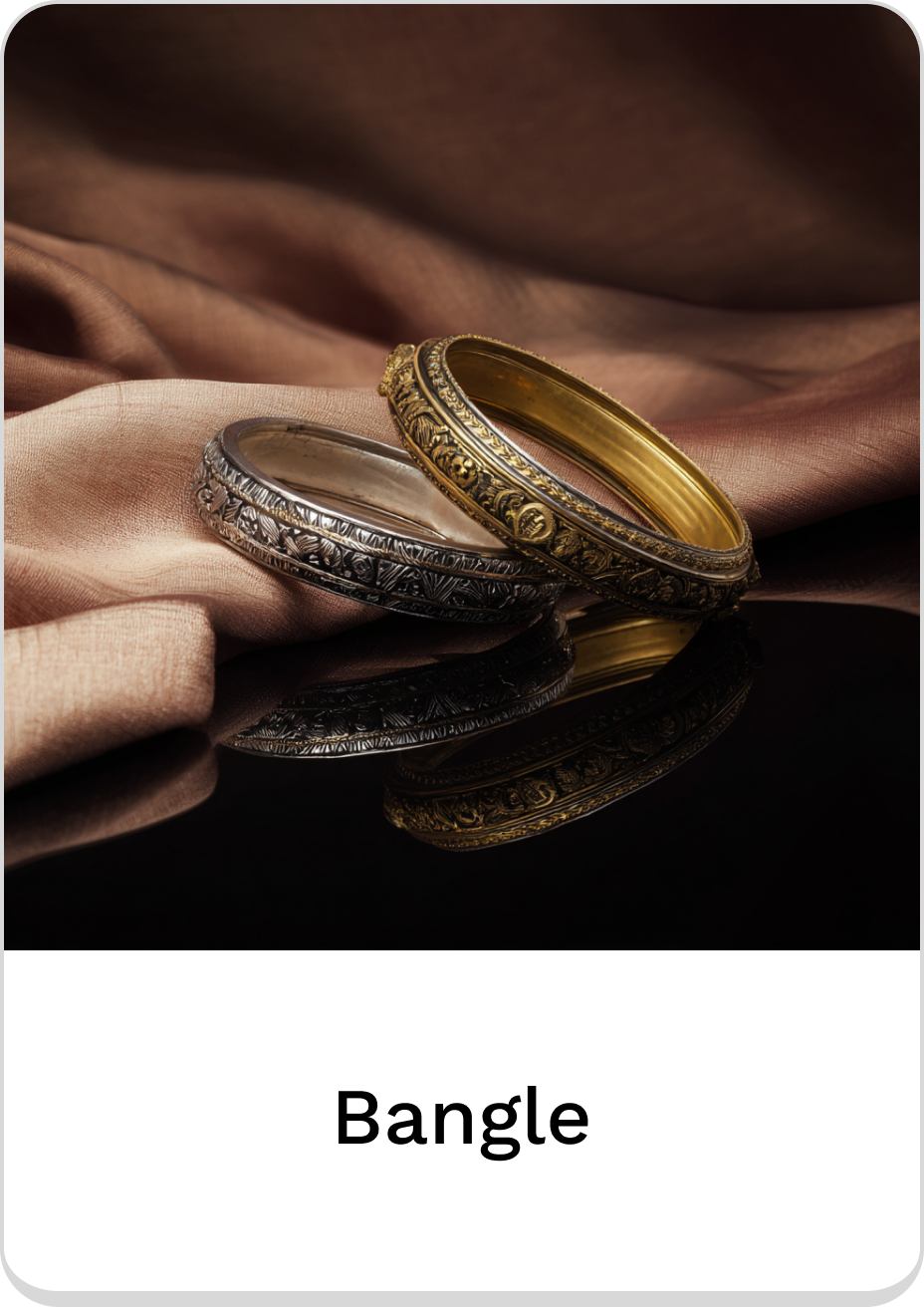 Elegant metal bangles showcasing intricate designs and textures on a soft fabric background.