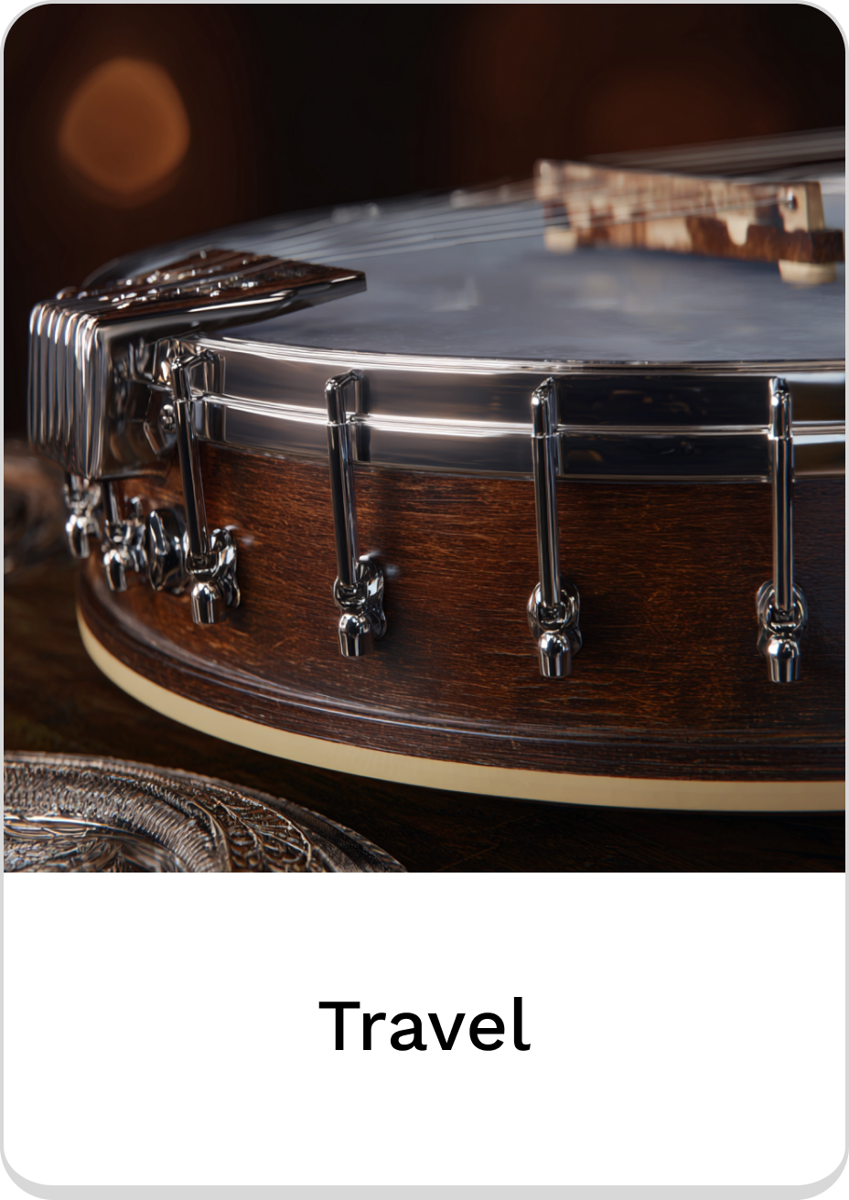 Close-up of a beautifully crafted travel banjo with polished metal detailing.