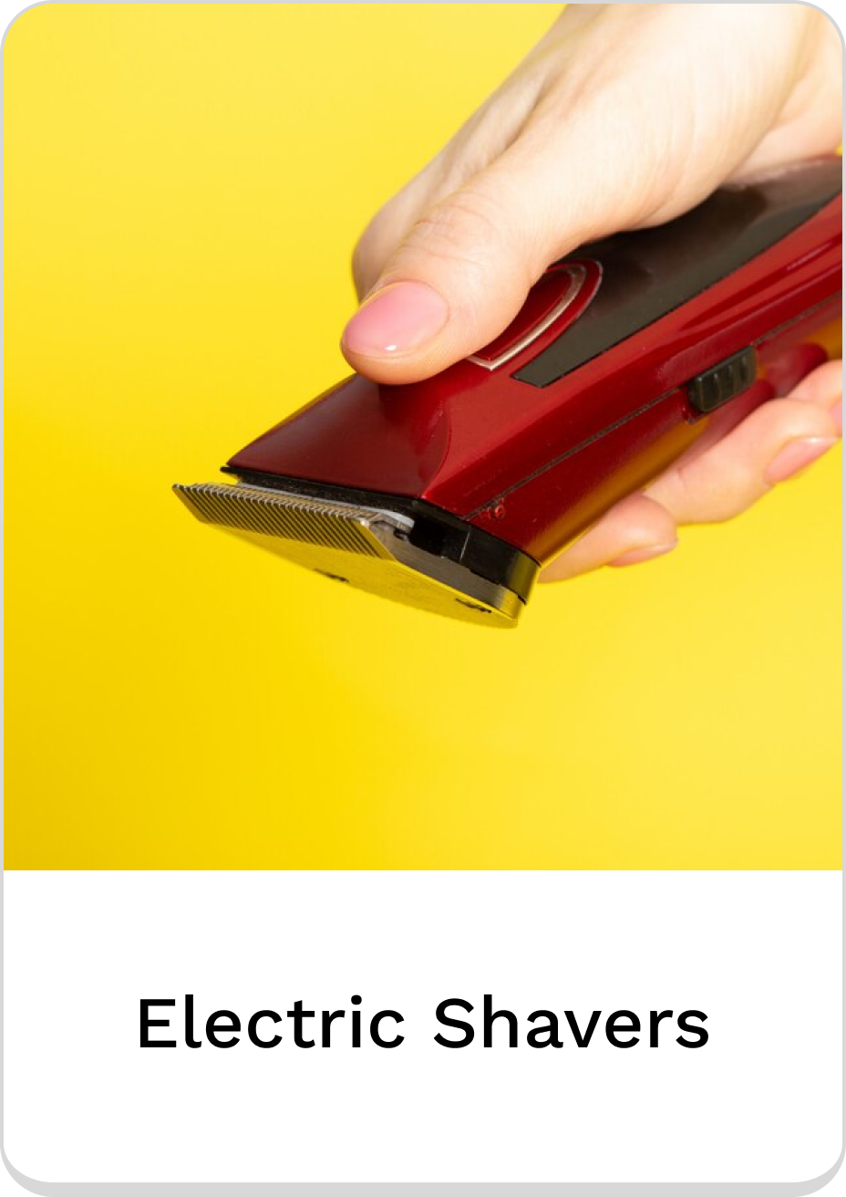 Hand holding a sleek red electric shaver for precision grooming.