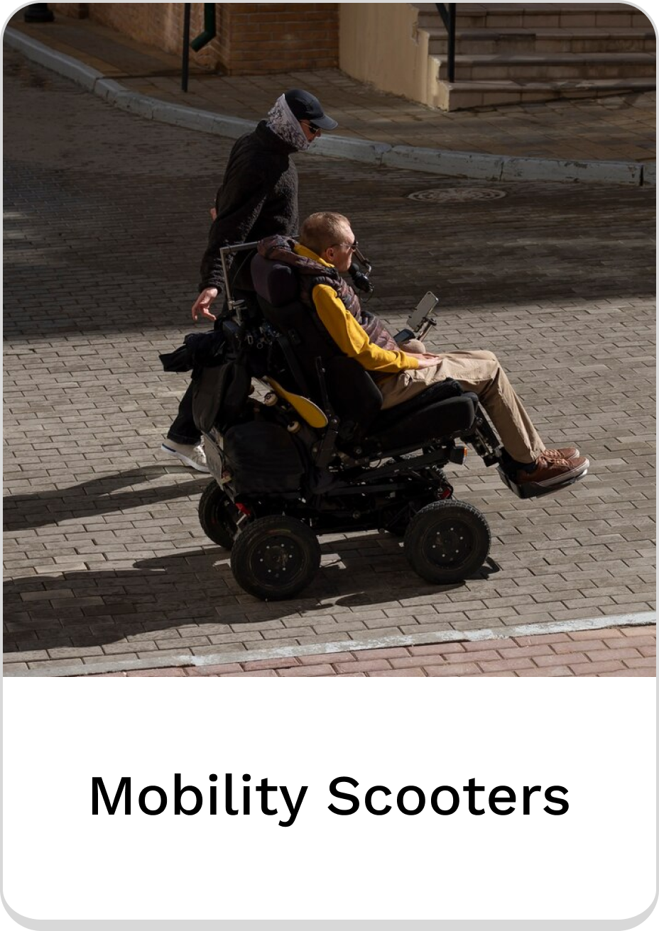 Person on a mobility scooter navigating a city street. Mobility scooters for independence.