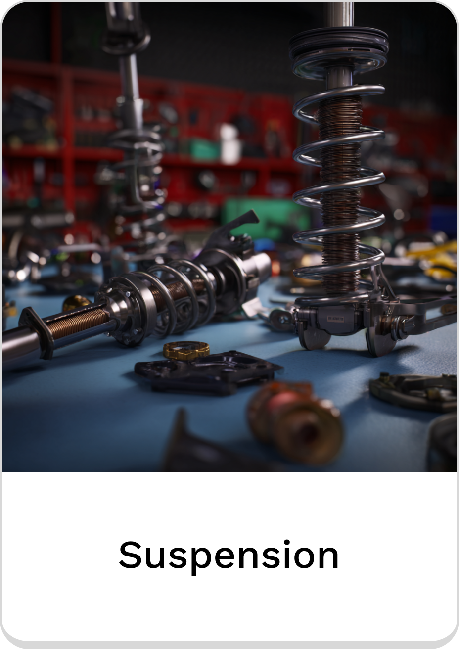 Close-up of various suspension parts on a workbench for automotive repairs.