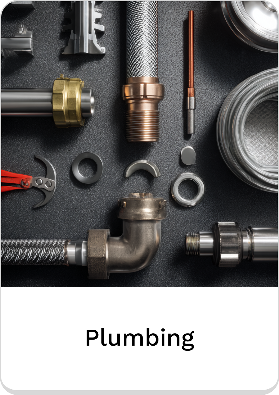 Plumbing tools and fittings arranged on a dark surface.