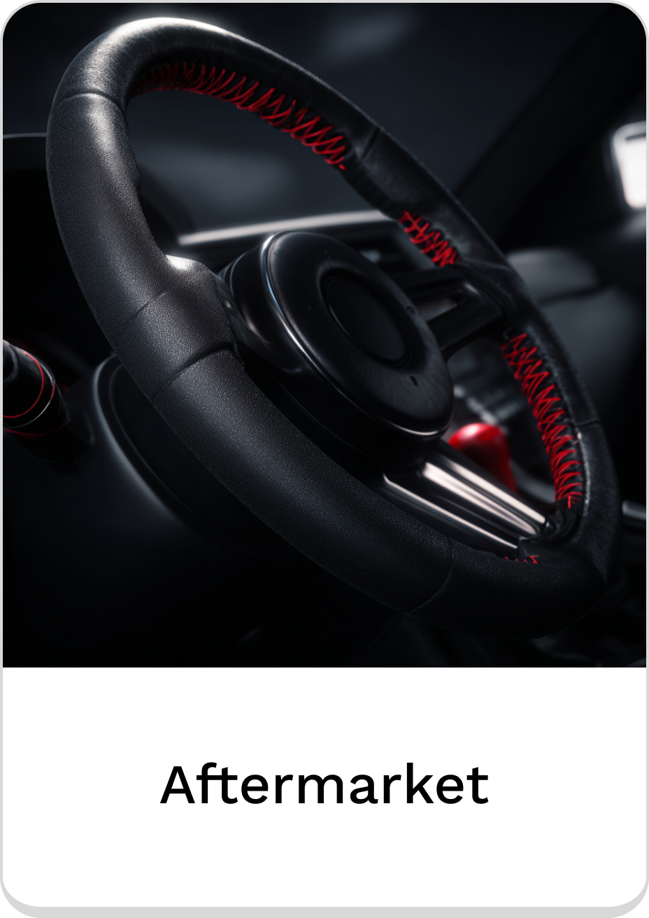 Stylish aftermarket steering wheel with red stitching for enhanced grip and style.