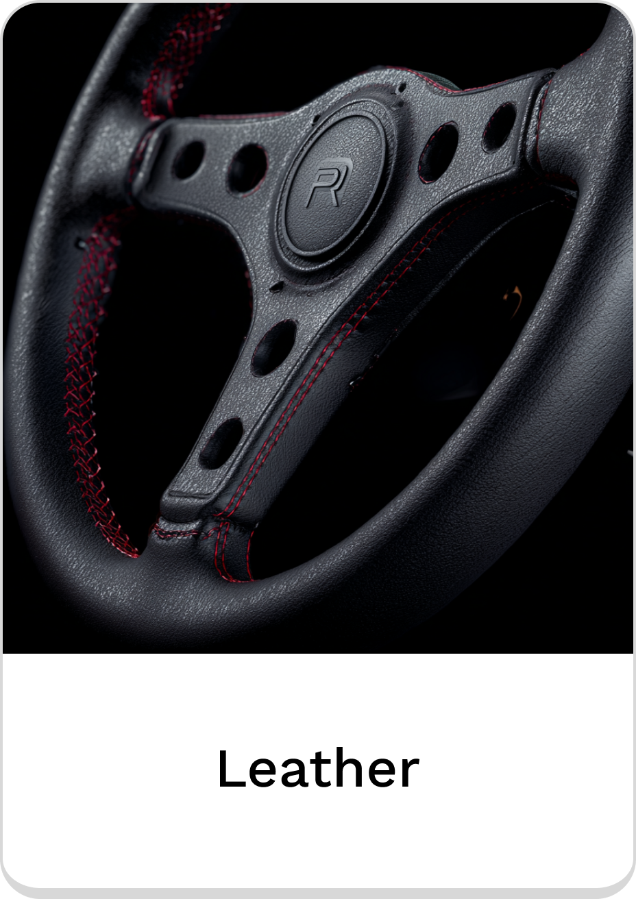 Premium leather steering wheel with contrast stitching for enhanced grip and style.