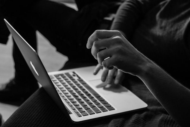 A shopper holding a laptop 