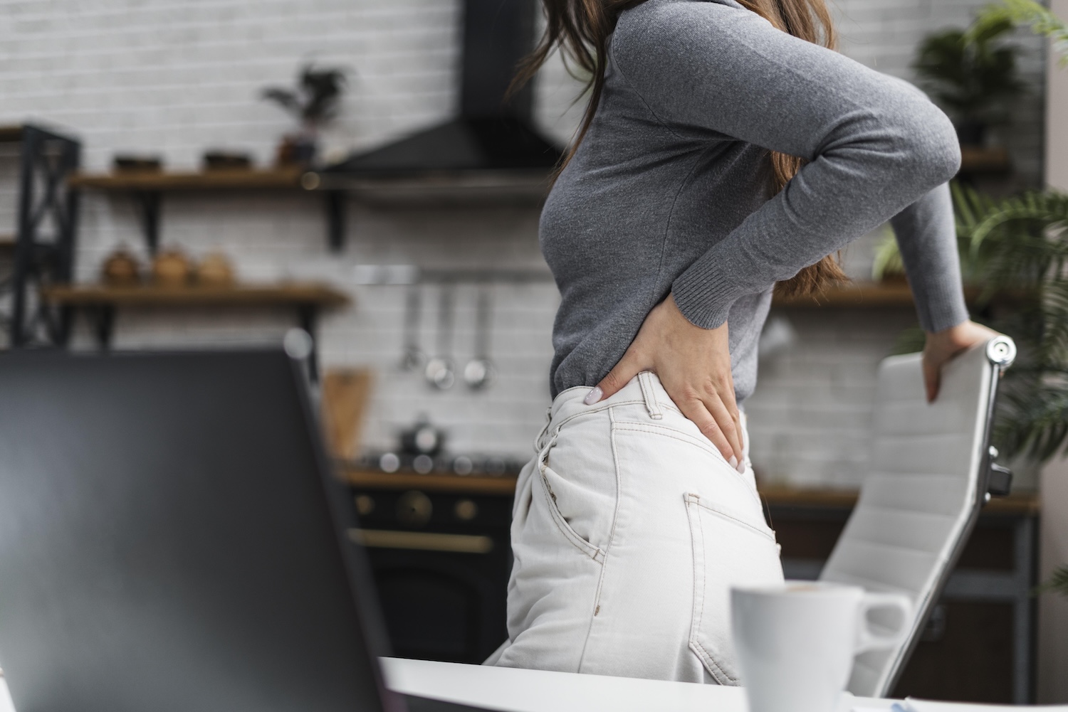 Physiotherapist treating a trigger point in a patient's shoulder and neck area