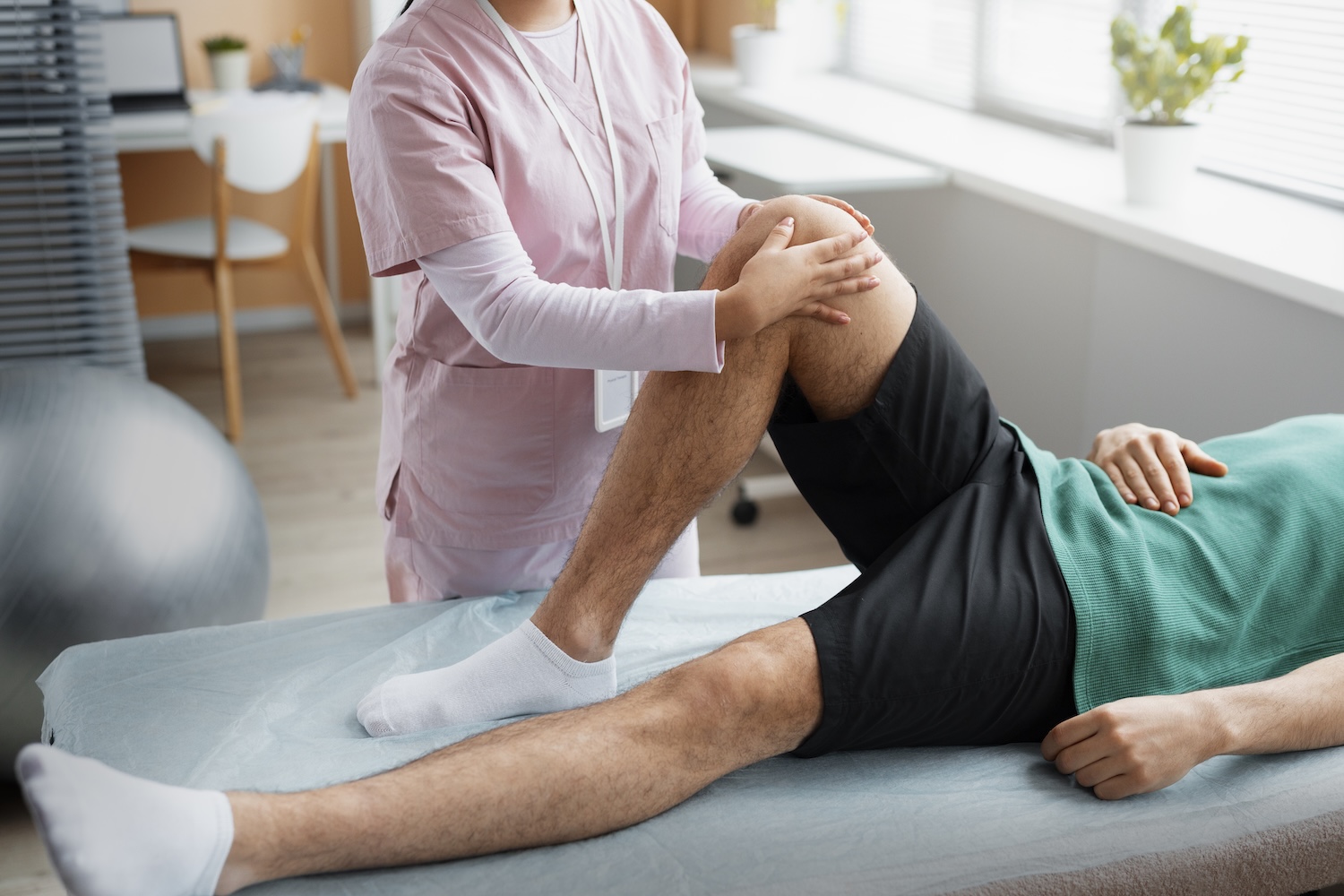 A man has his knee treated in physiotherapy after surgery.