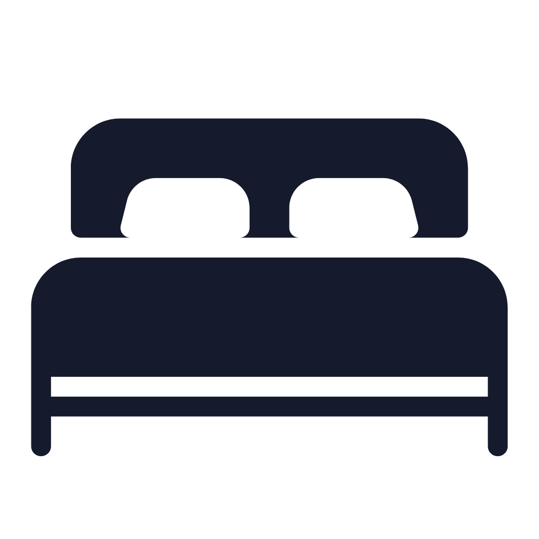 Black icon of a double bed with two pillows and a rounded headboard.