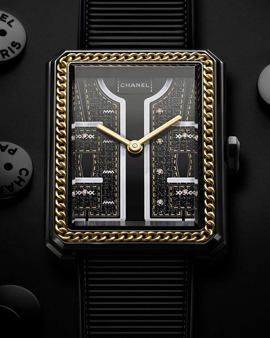 Focus on the dial of the Chanel Boy Friend Watch, sewing buttons placed on the black background, Couture Collection, 2024
