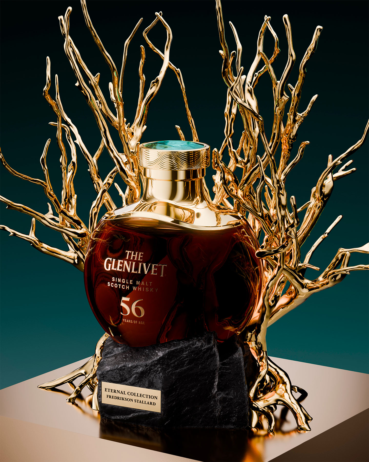The Glenlivet 56 Year Old single malt whisky bottle cradled within sculptural gold branches on a dark stone base.